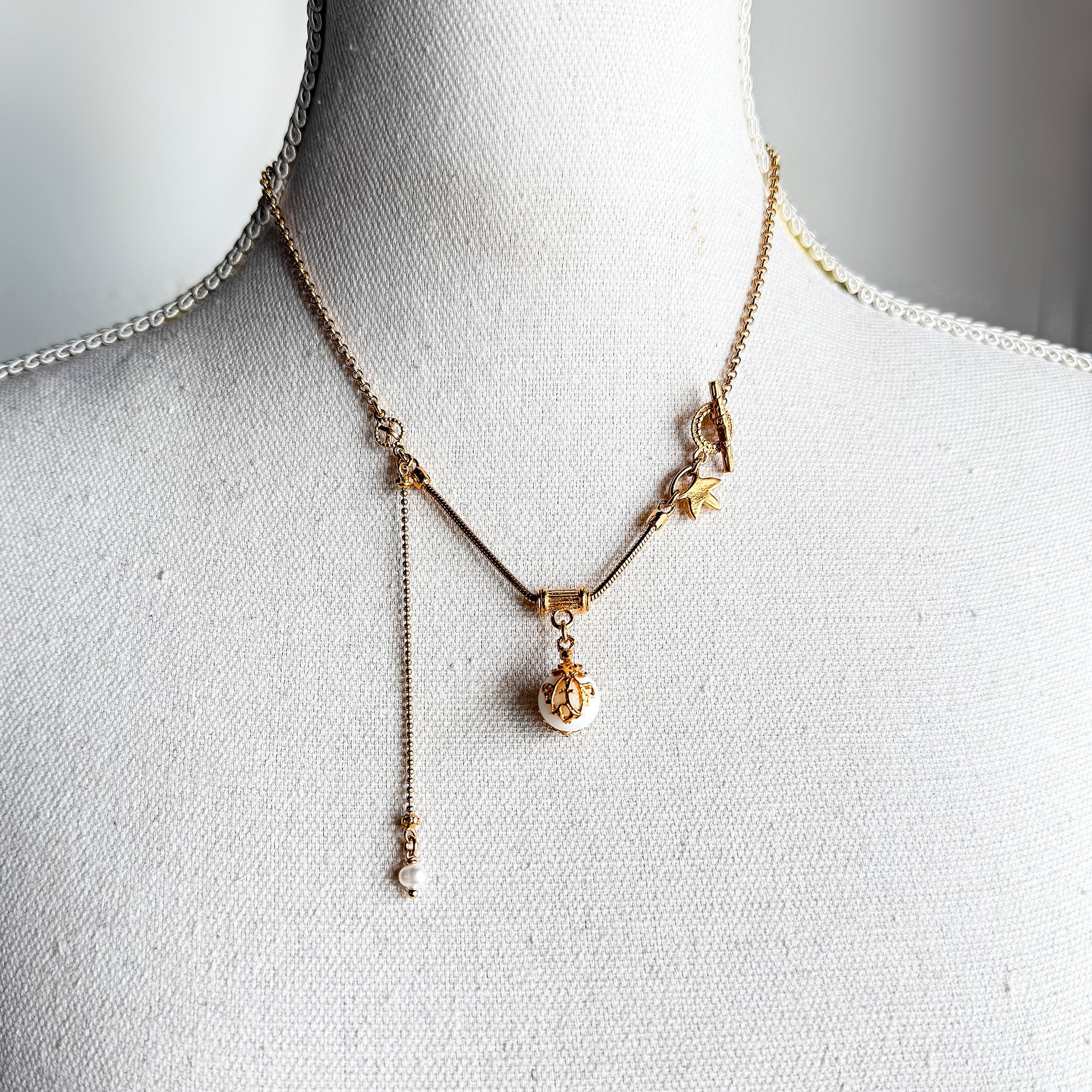 NK 25g35A white orb charm necklace